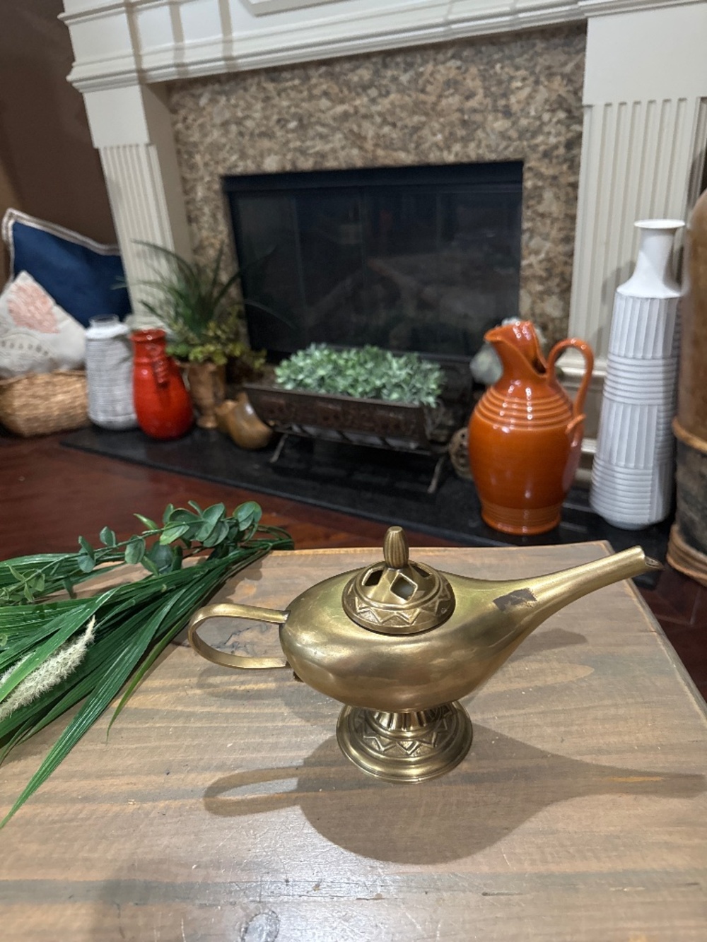 Lidded brass lamp with candle inside. 10”L x 5”T